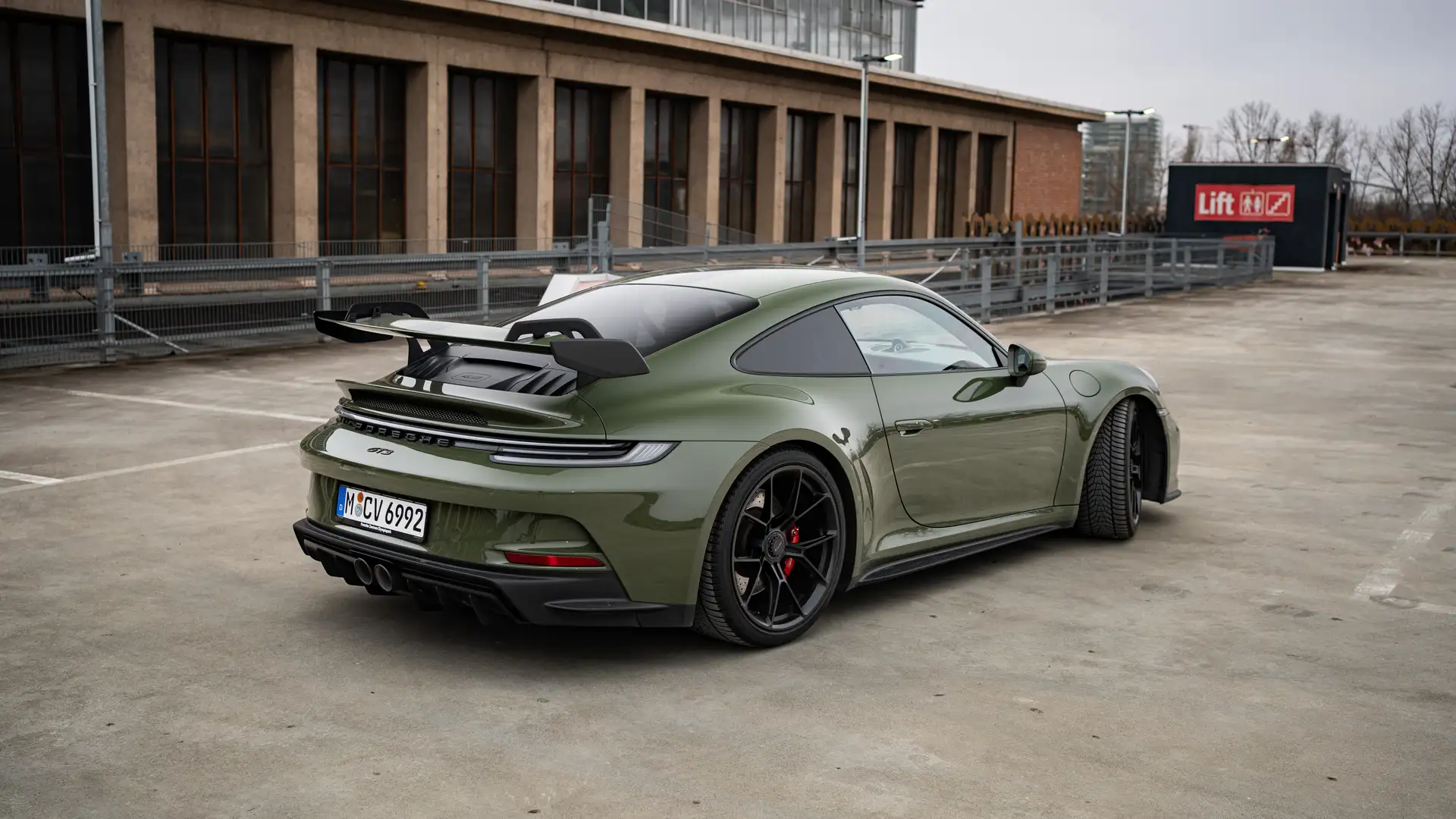 Side view of our Porsche GT3 in Nato Olive.